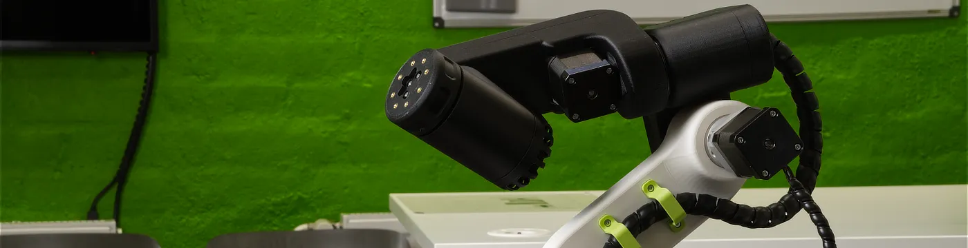 A side-angle view photo of the GK-RA robot on the background of a classroom.
